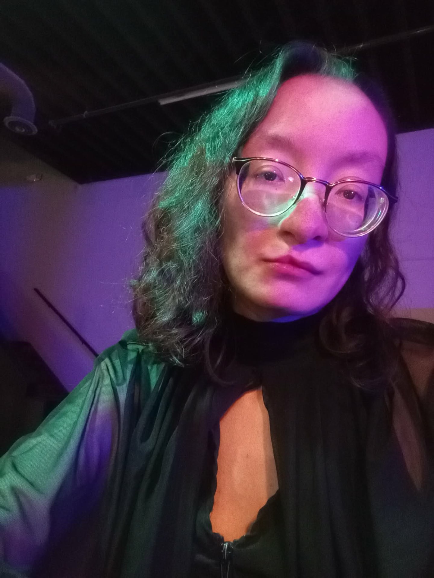 Muchtar under green and violet stage light